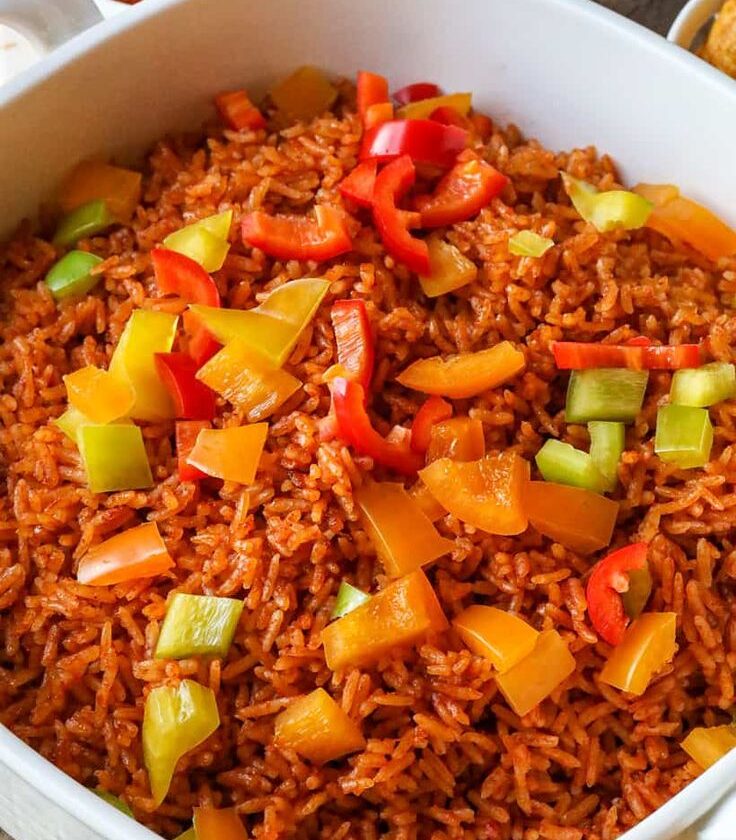Ghanaian vegetable Jollof rice with red seasoned chicken